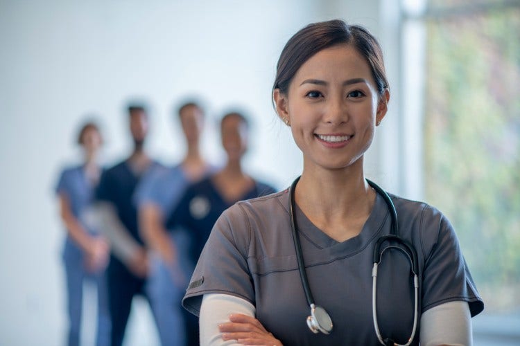 A smiling nurse practitioner.