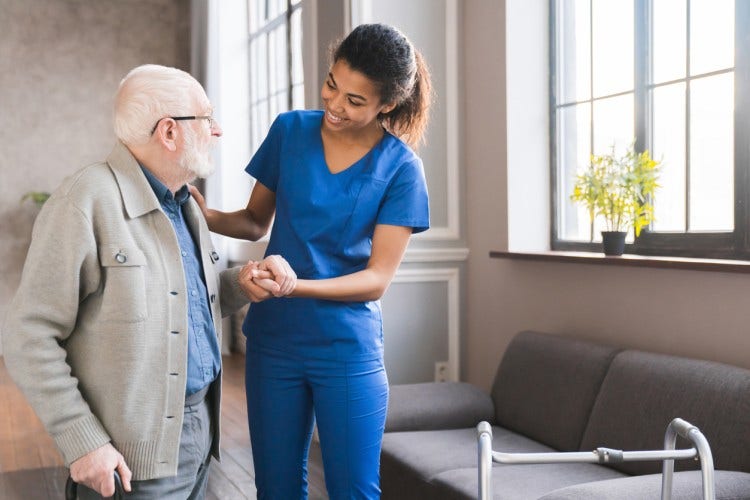 A nurse practitioner talks with a patient.