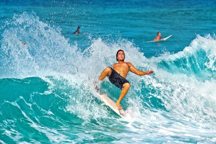 surfer loses balance and falls